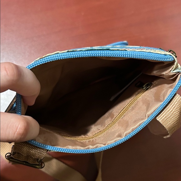 Disney's Animal Kingdom Harambe Safari Crossbody - Picture 3 of 3